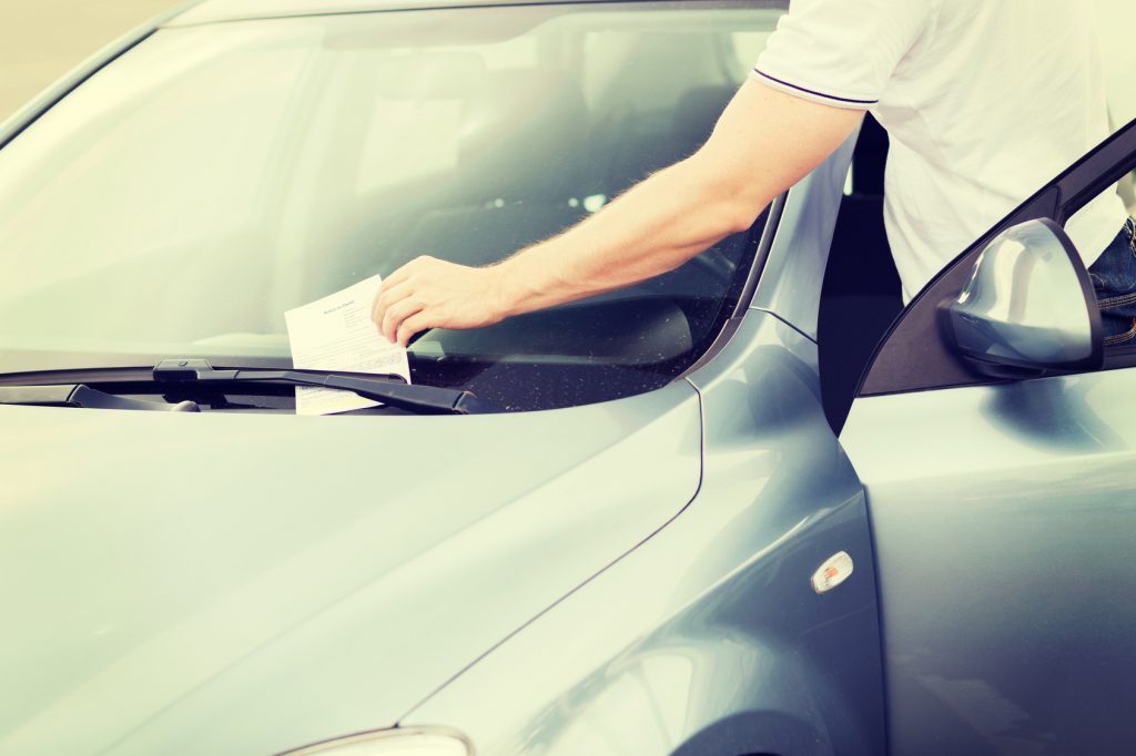 parking ticket on car windscreen